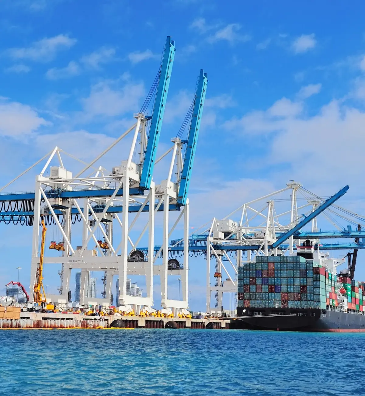 Ship-to-shore cranes unloading a container ship