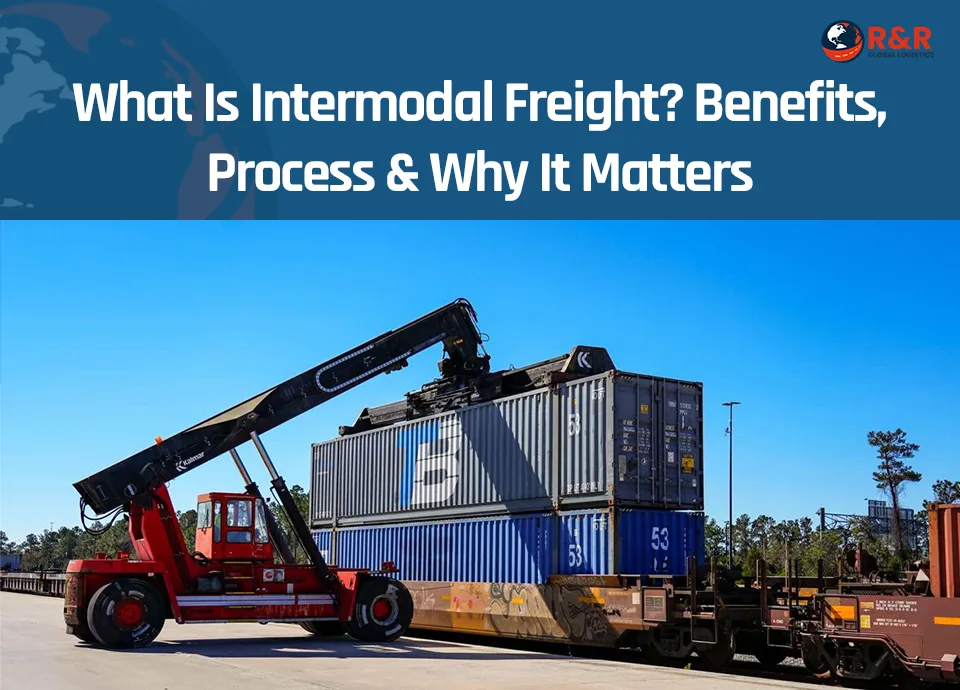 Intermodal container being transferred between truck and train at a logistics terminal.
